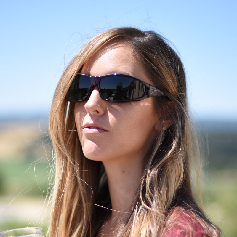 Jory Paul wears elegant cherry red vistana, featuring technology made popular by Cocoons. They're easy to wear over prescription eyeglasses.