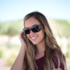 Jory Paul wears burgundy Vistana fit over sunglasses with gray polarized lenses to shield her eyes from solar radiation.