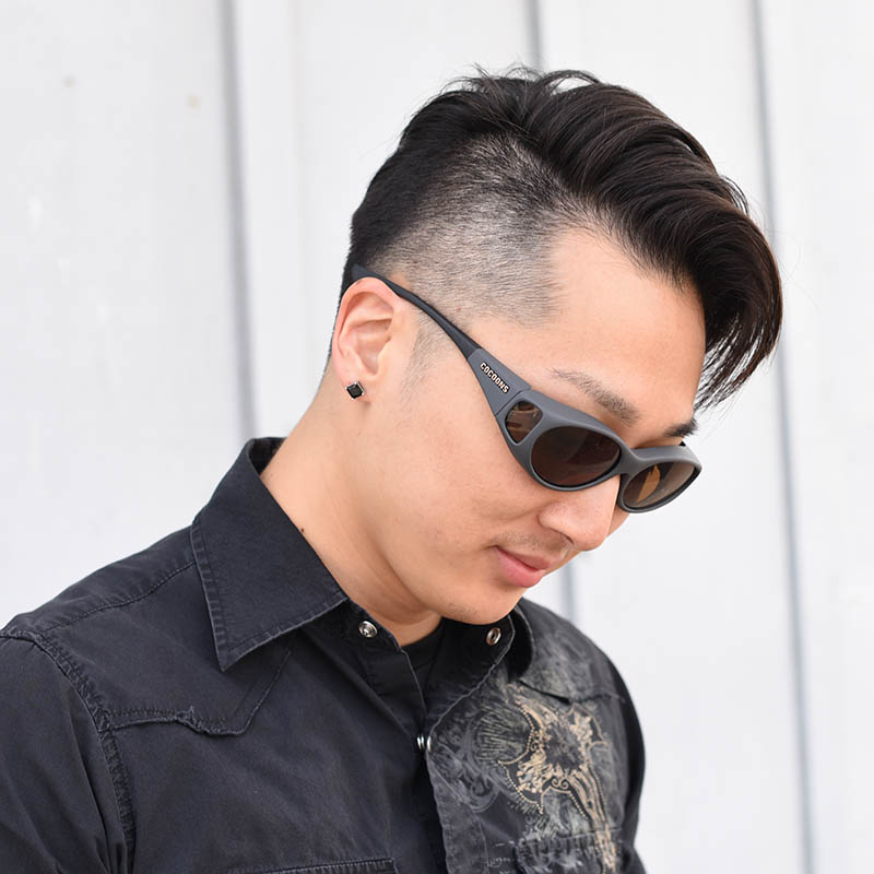 dragon guy wearing Cocoons fitover sunglasses