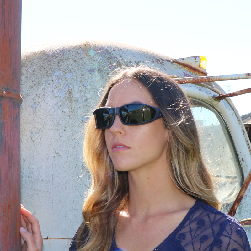 Jory Paul is wearing Vistana fit overs with a matte violet finish over her prescription eyeglasses.